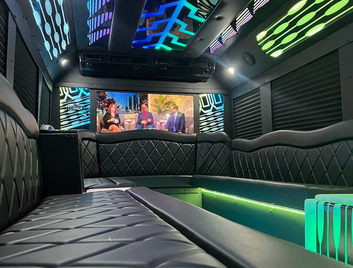 Group of friends celebrating on a luxury party bus